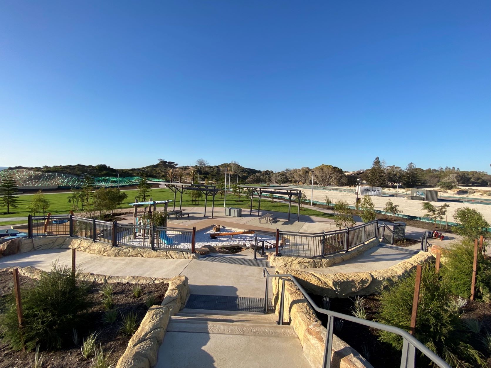 A spacious park with a big playground and vast grassy area, located at Capricorn Beach.