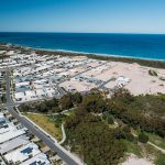 Aerial view of a residential area in Yanchep with beachside houses near the ocean