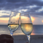 Champagne glasses clinking at sunset, perfect for date ideas in Yanchep