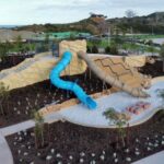 Capricorn Beach foreshore featuring newly completed slides and landscaped areas