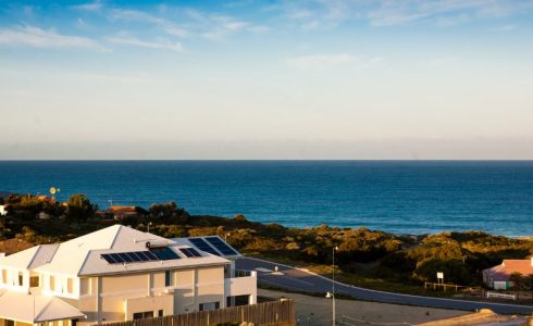A scenic view of Yanchep coastal getaway accommodation with a backdrop of the ocean and coastline