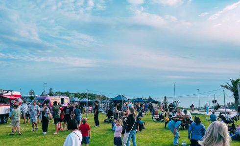 Yanchep Pop-Up with market stalls and people enjoying coastal summer activities by the sea