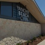 Exterior signage of the Yanchep Beach Club overlooking the coastal building façade.