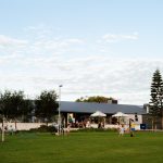 People enjoying the open community space at Yanchep Beach Club near Capricorn Beach.