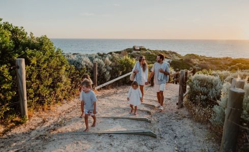 Family enjoying a coastal walk at Capricorn Beach Yanchep with ocean views