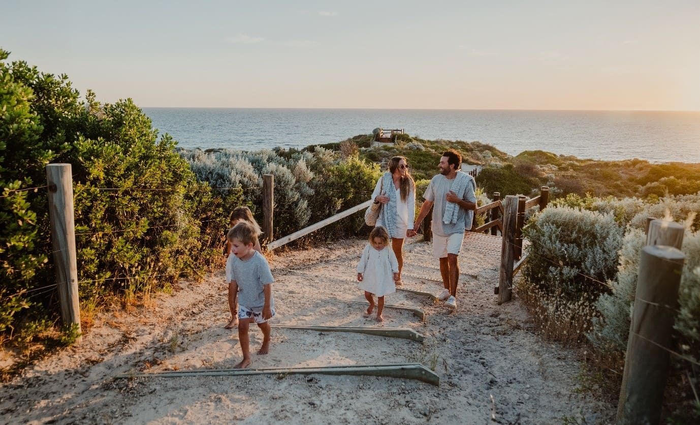 Family enjoying a coastal walk at Capricorn Beach Yanchep with ocean views